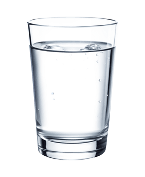Clear glass of ice cold water on a table png
