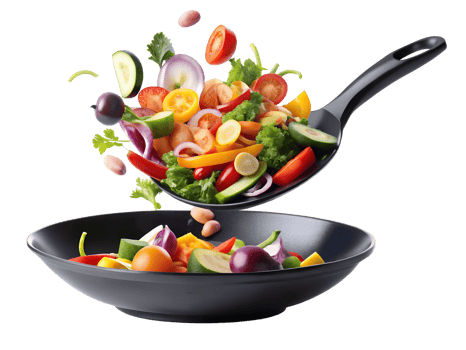 Fresh vegetables being tossed in a black bowl png