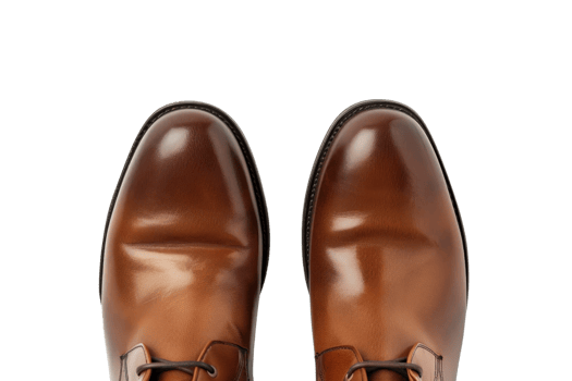 Top view of polished brown leather dress shoes on a transparent background. showcasing elegance and sophistication in formal footwear. png
