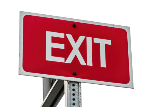 Red exit sign with white letters mounted on a metal post, isolated on transparent background. Ideal for directional, safety, and informational purposes. png