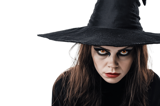 Close-up of a woman in a witch costume with dark makeup and a hat, glaring intensely at the camera. png