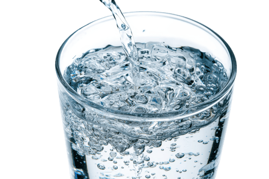 Close-up of fresh, clear water being poured into a glass, creating bubbles and showing purity and refreshment. png