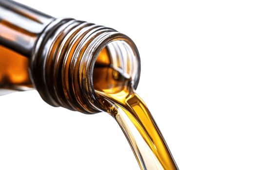 Close-up of a pouring golden liquid from a brown bottle, isolated on transparent background. representing oil, syrup, or similar substance. png