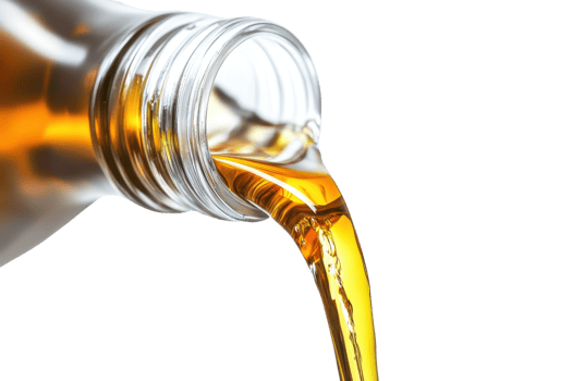 Close-up of golden liquid pouring from a glass bottle. Perfect for concepts of beauty, health, cooking, or natural products. png