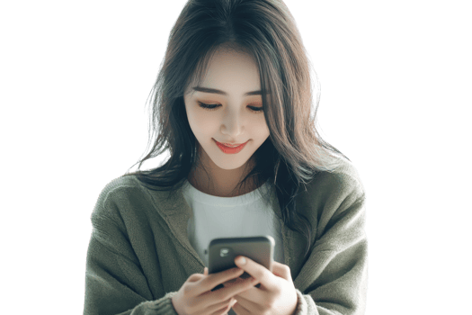 Young woman smiling while looking at her phone, wearing a green cardigan and white top, isolated on a transparent background. png
