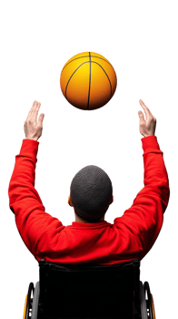 Person in a wheelchair tossing a basketball upward on a transparent background png