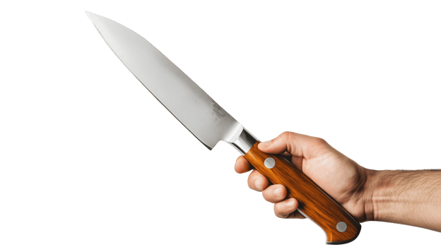 A person holding a chef's knife with a wooden handle in a kitchen setting png