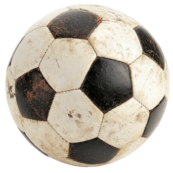 Worn soccer ball sitting on a grassy field png