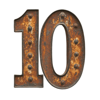Old rusted metal number ten with rivets displayed png