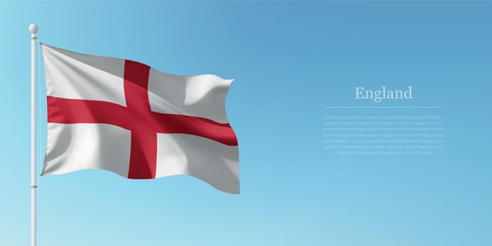 Waving Flag of England Against Clear Blue Sky Copyspace vector