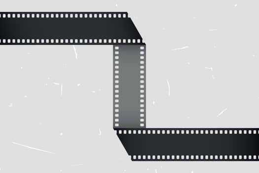 Folded movie film strip on grunge background vector