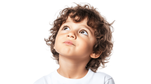 Young child with curly hair looking upwards in curiosity, captured indoors during daylight hours. png