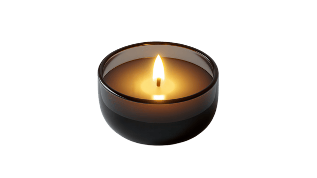A candle is lit in a glass vase png
