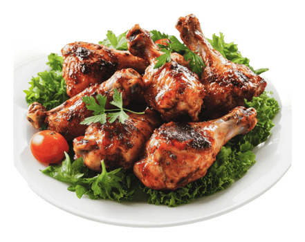Grilled chicken drumsticks served on fresh greens png