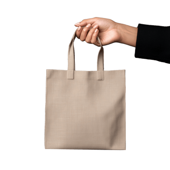 Hand holding a beige tote bag on transparent background png
