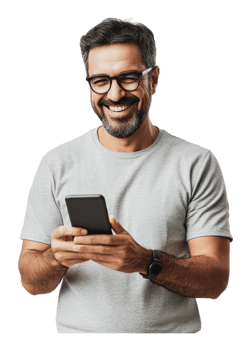 Man smiling while using smartphone indoors png