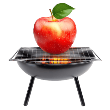 Grilled apple on a barbecue grill with flames png