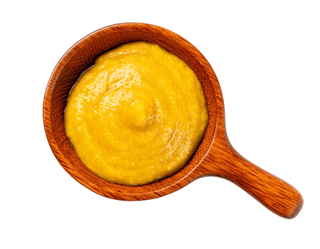 A bowl of vibrant yellow mustard, perfect for flavoring dishes and enhancing taste. png