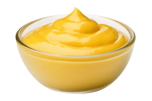 A bowl of yellow sauce on a black background png
