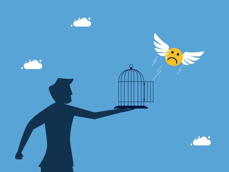 man holding a bird cage with gold coins flying away from it vector