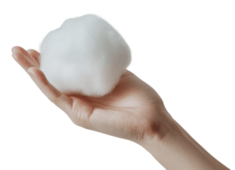 Soft cotton ball held delicately in a hand png