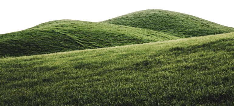 Rolling green hills under bright sky landscape png