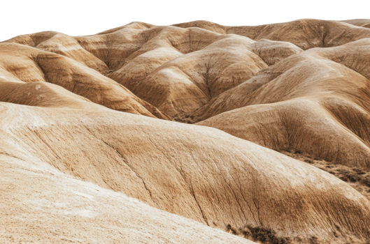 Unique rolling hills in arid landscape at sunset png