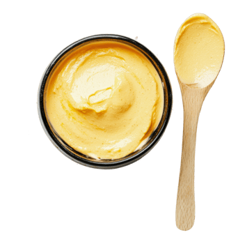 Creamy yellow dip served with a wooden spoon png