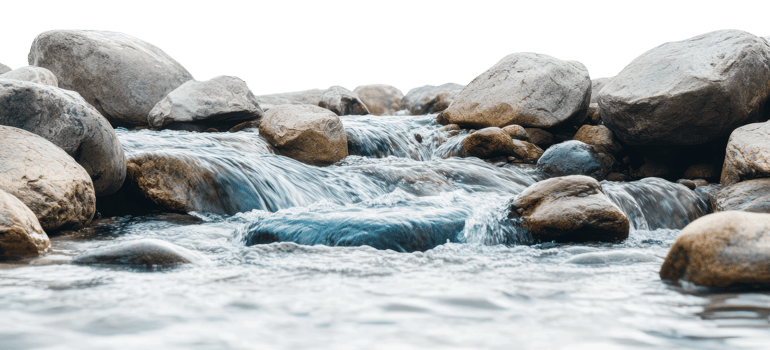 Water flows over smooth stones png