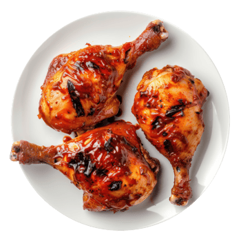 chicken wings on a plate with sauce on it png