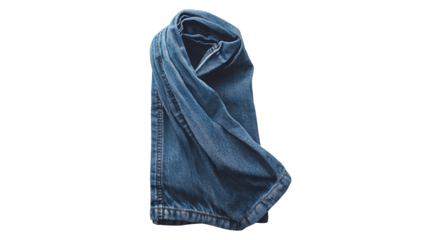 A pair of jeans folded up on a black background png
