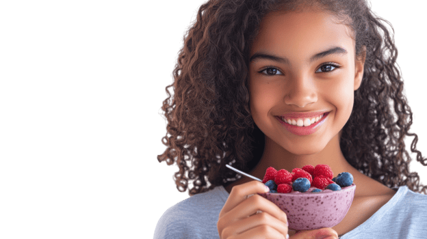 A Teenage Girl Enjoying a Delicious Acai Bowl on a White Surface, Perfect for Healthy Eating Inspiration and Food Photography. png