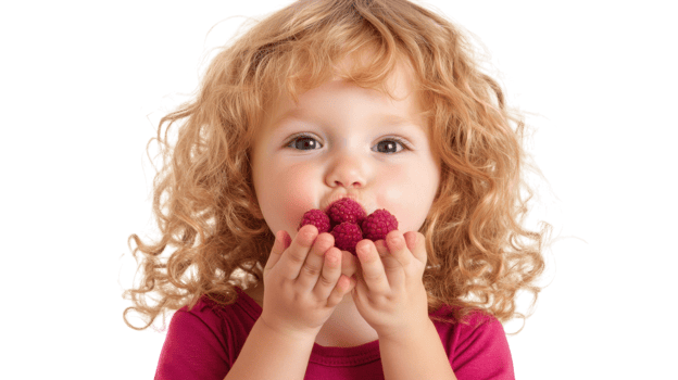 Charming Image of a Playful Toddler Blowing Raspberries Against a White Background Perfect for Family and Parenting Blogs or Childcare Advertisements. png