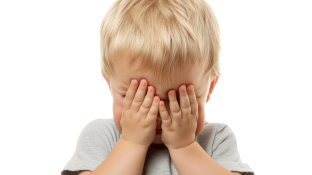 A Captivating Image of a Distressed Toddler Covering Their Face While Crying, Perfect for Illustrating Emotions of Sadness and Vulnerability in Parenting or Childcare Topics. png