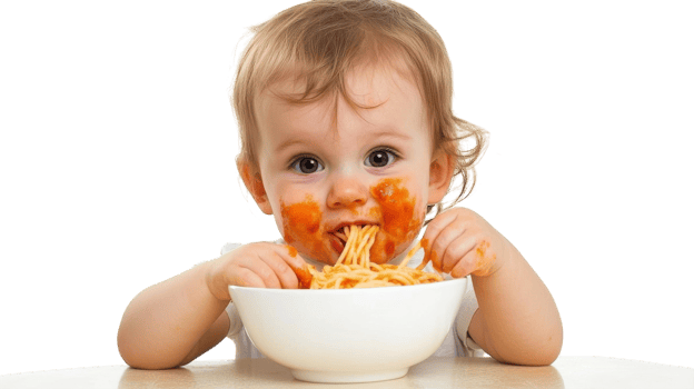 A Joyful Toddler Enjoying a Bowl of Spaghetti in a Bright Kitchen, Perfect for Family and Childhood-Themed Projects. png