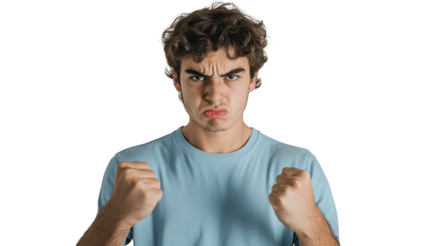 Portrait of a Young Man Displaying Anger with Clenched Fists, Perfect for Illustrating Emotional Expression, Conflict or Frustration in Various Contexts. png