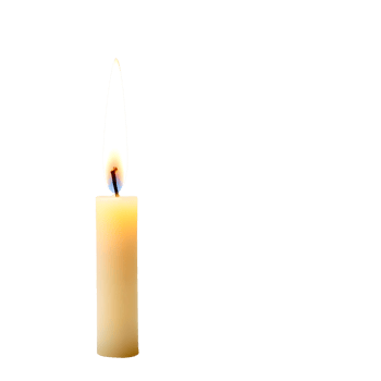 A single candle is lit on a black background png