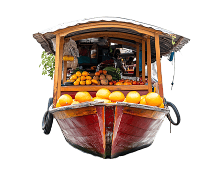 A colorful boat market stall displaying various fruits for sale. png