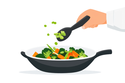 A hand adds green vegetables to a pan filled with colorful stir-fried vegetables. png