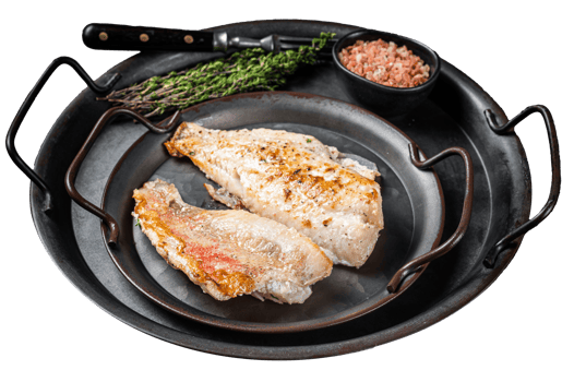 Roasted ocean red perch fillet with olive oil, thyme and spices. Black background. Top view png
