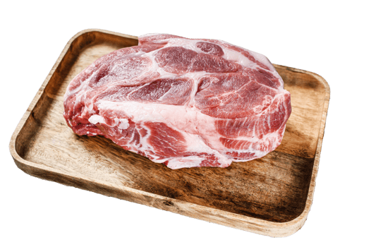 Pork neck piece on brown wooden chopping board. Gray background. Top view png