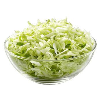 Freshly shredded green cabbage in a clear glass bowl, perfect for salads. png