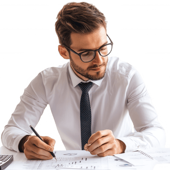 A focused professional analyzing data and working on financial reports at a desk. png