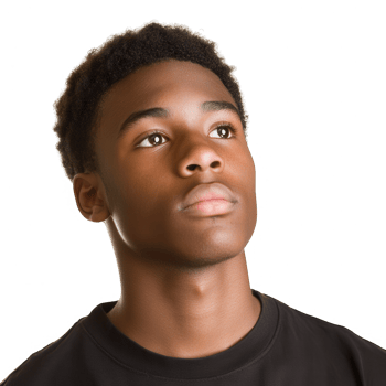A thoughtful young man gazing upward with a contemplative expression. png