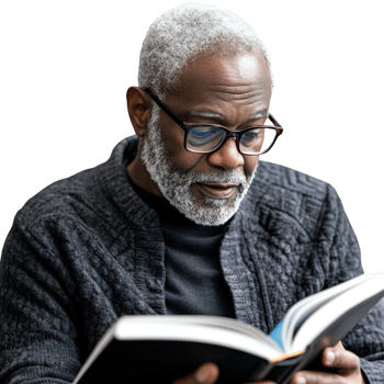 An elderly man enjoying a book, embodying wisdom and passion for reading. png