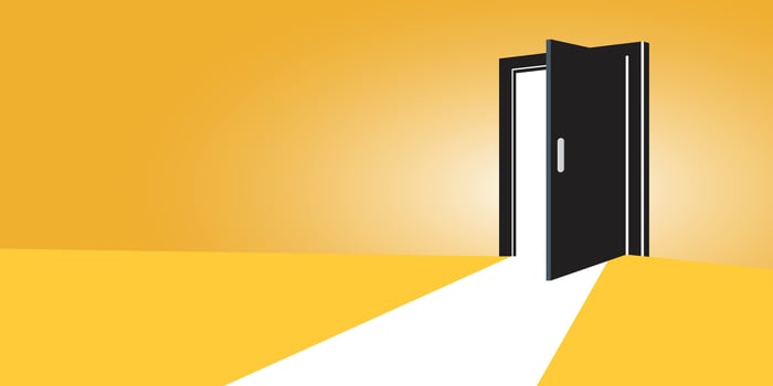 An open door leading to a yellow light vector