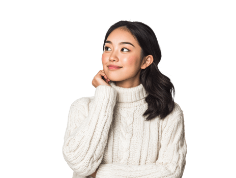 Young woman contemplating in cozy sweater indoors png