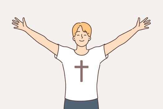 Religious man feels free and empowered by faith, dressed in t-shirt with crucifix on chest vector