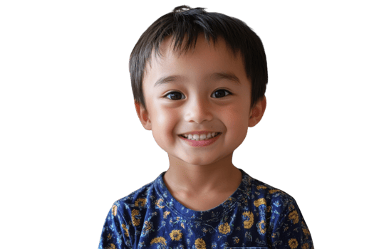 Smiling boy wearing a blue floral shirt with short black hair and bright eyes showcasing joy and innocence indoors png