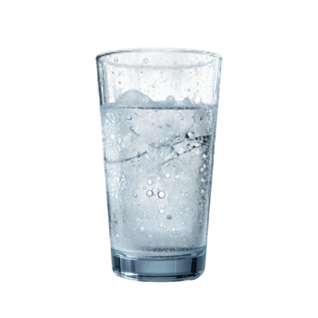 Refreshing Glass of Sparkling Water with Ice Cubes, A Close-Up Studio Shot of a Glass Filled with Icy, Bubbling Water png